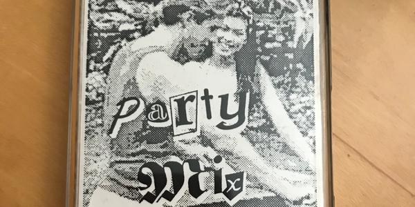 Photo of the album cover: a man and a woman smiling and grilling